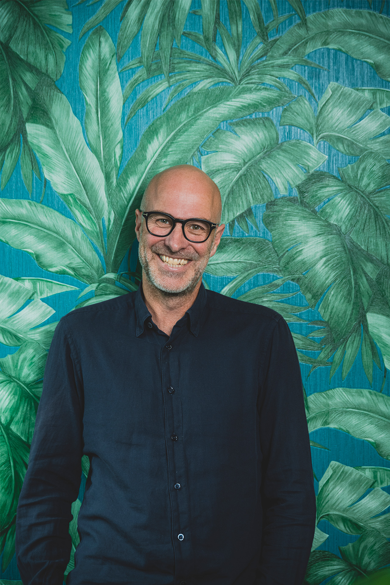 Portrætbillede af Ørnulf Johnsen der smiler til kameraret